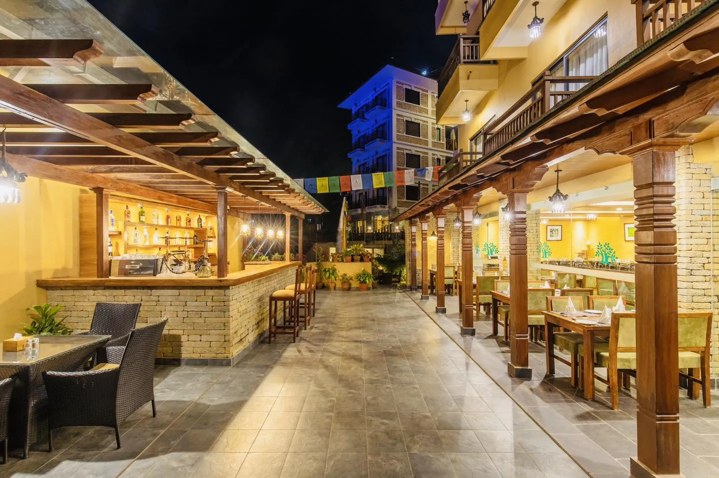 The bar and courtyard at Bar Peepal Resort at night