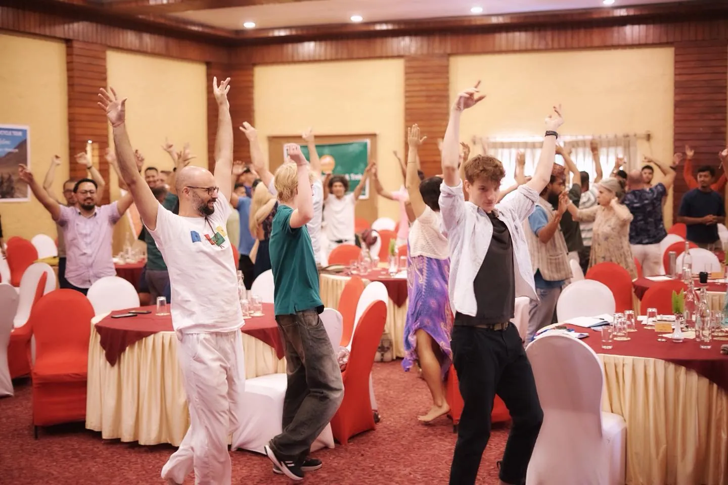 Guests dancing in Manjung Hall during a summit at Bar Peepal Resort