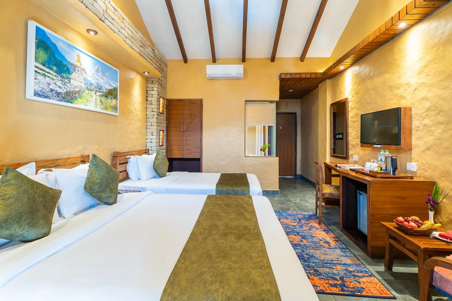 Twin beds under a timber ceiling